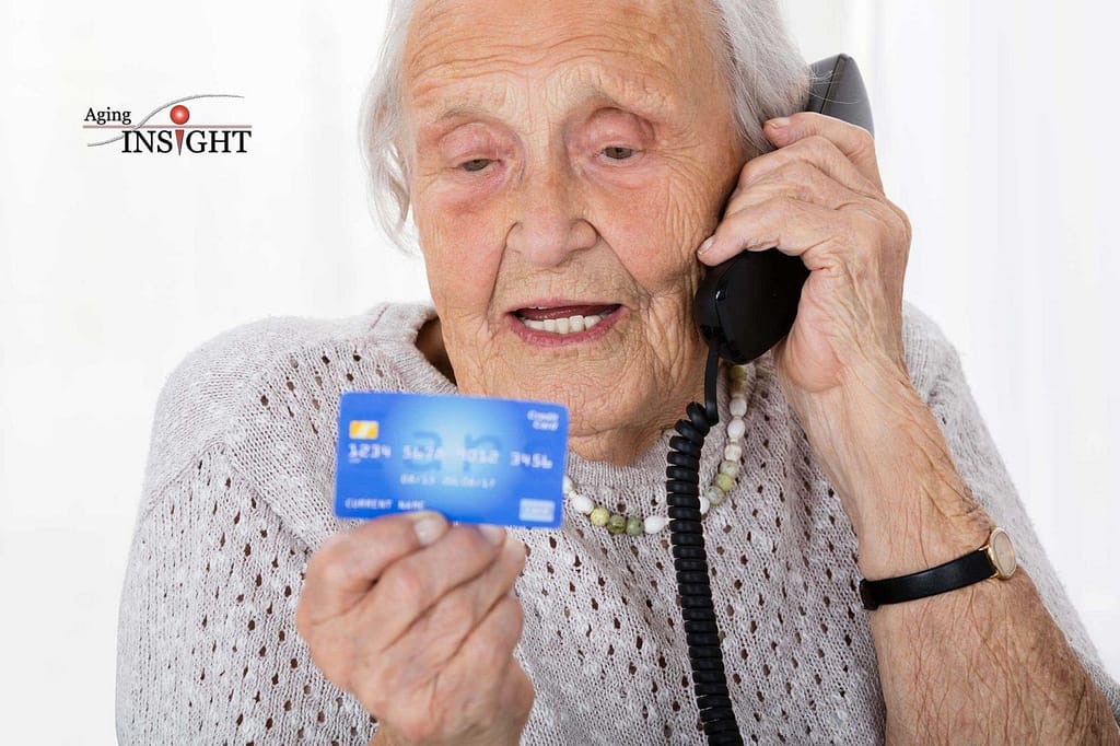 Senior Woman With Credit Card On Phone